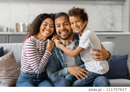 Portrait Of Happy Young African American Family Of Three With Little Son 111707657