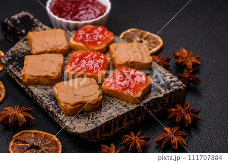 Delicious nutritious sandwiches with peanut butter, strawberry jam Delicious nutritious sandwiches with peanut butter, strawberry jam 111707884
