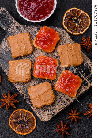 Delicious nutritious sandwiches with peanut butter, strawberry jam Delicious nutritious sandwiches with peanut butter, strawberry jam 111707886