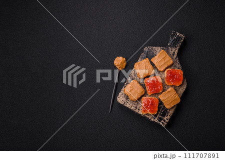 Delicious nutritious sandwiches with peanut butter, strawberry jam Delicious nutritious sandwiches with peanut butter, strawberry jam 111707891