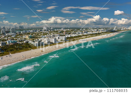 Ocean warm waters and sandy beachfront at Miami Beach in Florida, USA. American travel destination 111708035