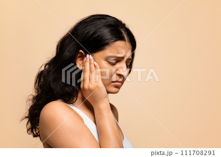 Headache Concept. Portrait of stressed young indian woman suffering from migraine 111708291