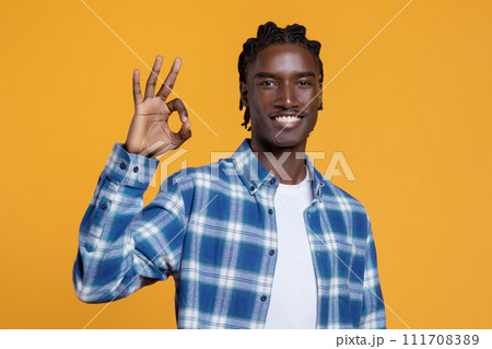 Portrait Of Positive Young Black Guy Showing Ok Gesture At Camera Portrait Of Positive Young Black Guy Showing Ok Gesture At Camera 111708389