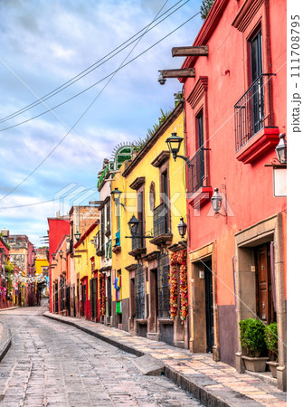 Beautiful street with traditional houses in San Miguel de Allende in Guanajuato, Mexico Beautiful street with traditional houses in San Miguel de Allende in Guanajuato, Mexico 111708795