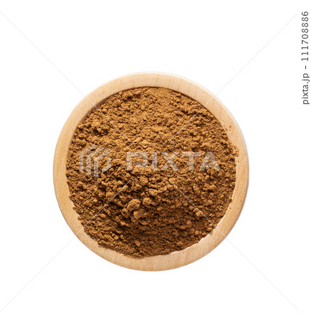 cinnamon powder in a wooden bowl isolated on a white background, top view. cinnamon powder in a wooden bowl isolated on a white background, top view. 111708886
