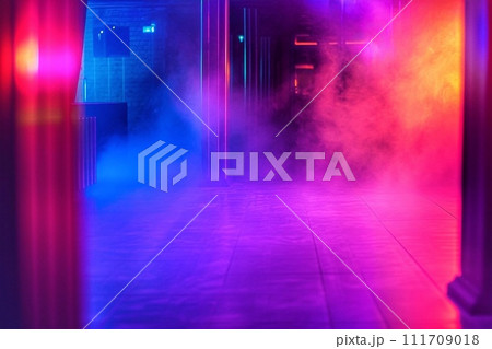 Colorful smoke in a dark room illuminated by red and blue lights Colorful smoke in a dark room illuminated by red and blue lights 111709018