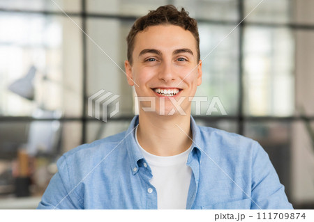Portrait of positive attractive millennial caucasian man manager worker look at camera Portrait of positive attractive millennial caucasian man manager worker look at camera 111709874