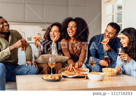 Carefree group of students friends having party with pizza indoor 111710203