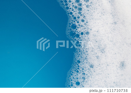 Detergent foam bubble on water. Blue background, Soap sud 111710738