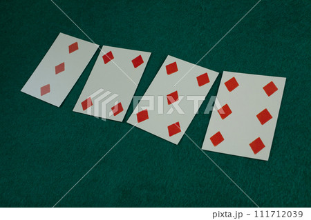 Old west era playing card on gambling table. 3, 4, 5 , 6 of diamonds. 111712039