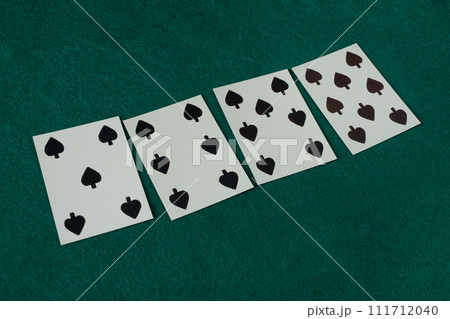 Old west era playing card on gambling table. 5, 6, 7, 8 of clubs. Old west era playing card on gambling table. 5, 6, 7, 8 of clubs. 111712040