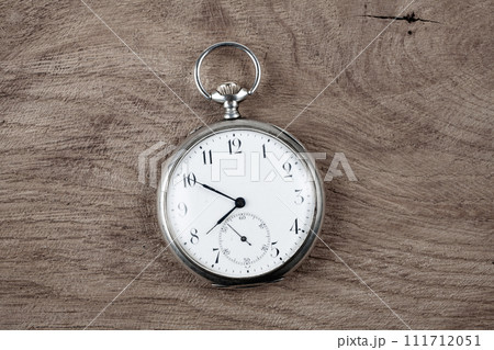 Pocket watch on wooden background Pocket watch on wooden background 111712051