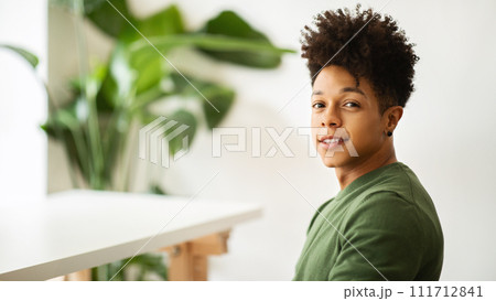 Portrait of handsome young black guy enjoying time at cafe Portrait of handsome young black guy enjoying time at cafe 111712841