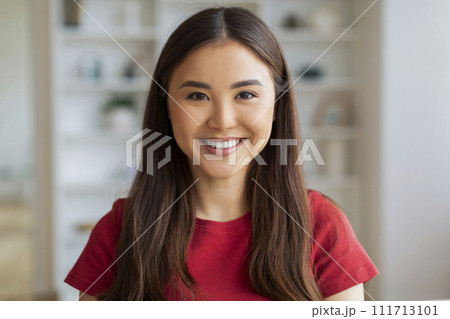 Closeup Portrait Of Beautiful Young Asian Woman Posing In Home Interior Closeup Portrait Of Beautiful Young Asian Woman Posing In Home Interior 111713101