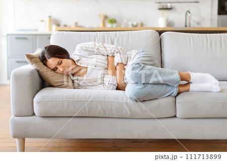 Stomach Ache. Sick Young Female Suffering From Acute Abdominal Pain At Home Stomach Ache. Sick Young Female Suffering From Acute Abdominal Pain At Home 111713899