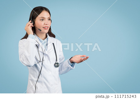 Woman doctor with headset in online consult Woman doctor with headset in online consult 111715243