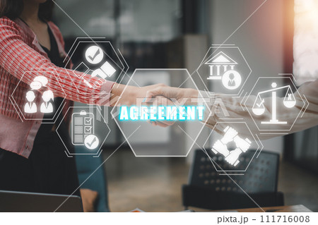 Agreement concept, Successful businessmen handshaking after good deal with agreement icon on virtual screen. Agreement concept, Successful businessmen handshaking after good deal with agreement icon on virtual screen. 111716008