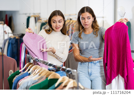 Woman with personal shopper shopping in store Woman with personal shopper shopping in store 111716204