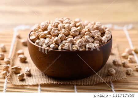 Organic dried chickpea in wooden bowl, Healthy food ingredient Organic dried chickpea in wooden bowl, Healthy food ingredient 111717859