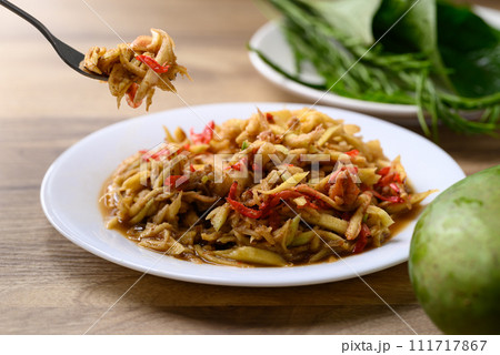 Thai food, Spicy mango salad with dry shrimp eating with fresh vegetables 111717867