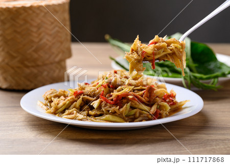Thai food, Spicy mango salad with dry shrimp eating with fresh vegetables and sticky rice Thai food, Spicy mango salad with dry shrimp eating with fresh vegetables and sticky rice 111717868