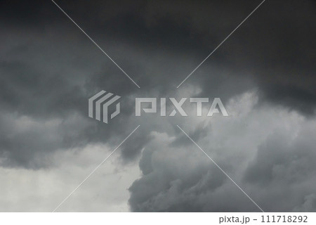 Dramatic dark storm thundercloud rain clouds on black sky background. Dark thunderstorm clouds rainny landscape. Meteorology danger windstorm disaster climate. Dark cloudscape storm disaster gray sky 111718292