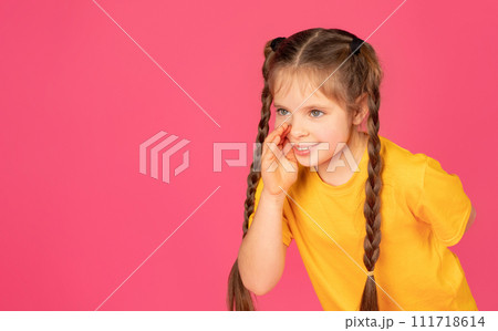 Beautiful Preteen Girl Holding Hand Near Mouth, Sharing News Or Gossips Beautiful Preteen Girl Holding Hand Near Mouth, Sharing News Or Gossips 111718614