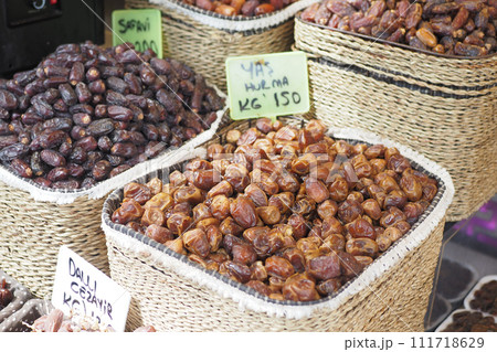 many date fruits display for sale at local market  111718629