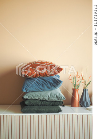 stack of colorful pillows on table  111719121