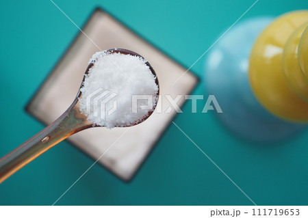 top view of spoon pick salt in a bowl 111719653