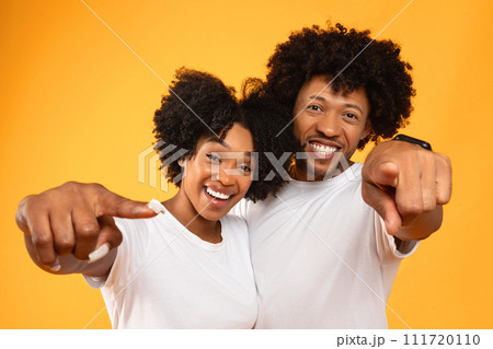 Cool african american friends man and woman pointing at camera 111720110