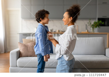 Black mother and son sharing moment, with loving eye contact Black mother and son sharing moment, with loving eye contact 111720447