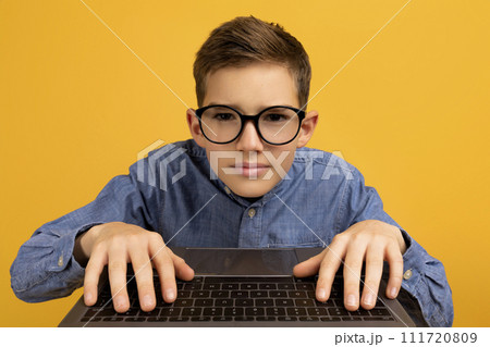 Pov Shot Of Nerdy Teen Boy In Glasses Using Laptop 111720809