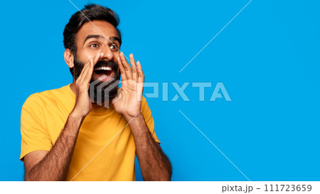Middle aged indian man shouting message with hands around mouth 111723659