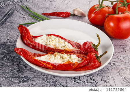 Baked red sweet ramiro pepper with curd Baked red sweet ramiro pepper with curd 111725864