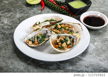 Open half oysters with green onion Open half oysters with green onion 111725922