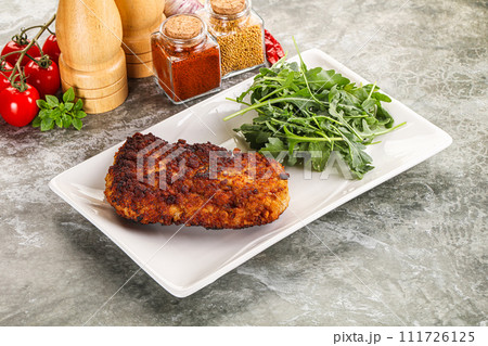 Tasty roasted breaded meat schnitzel Tasty roasted breaded meat schnitzel 111726125