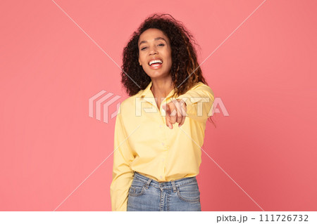 Happy black woman points at camera, choosing you on pink background 111726732