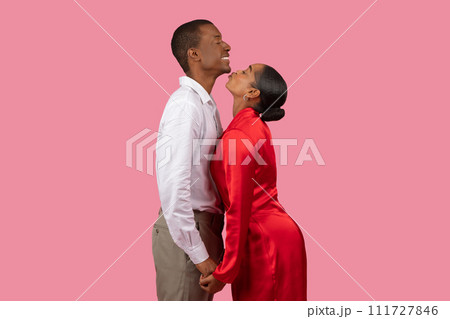 African american woman in red dress adoring man in white shirt 111727846