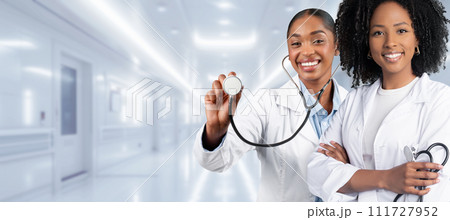 Two female healthcare professionals, one with a stethoscope ready for a checkup 111727952