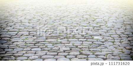 Old stone pavement texture on soft sunlight 111731620