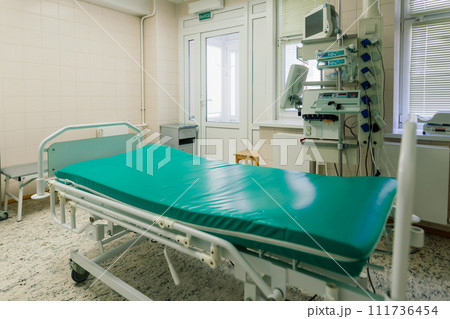 Interior of new operating room with equipment in modern clinic Interior of new operating room with equipment in modern clinic 111736454
