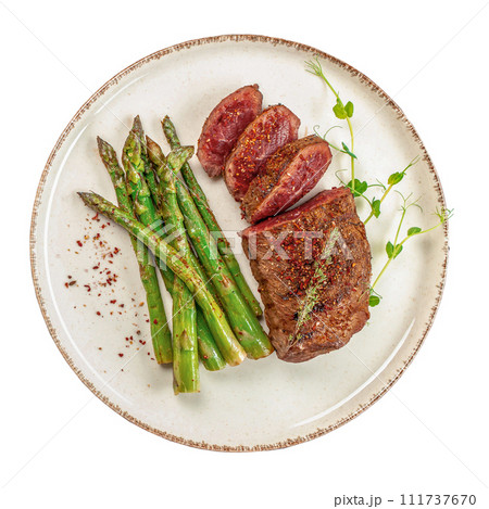 grilled beef steak with green asparagus isolated on white background, Roast beef with vegetables 111737670