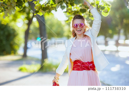 happy elegant 40 years old woman in dress and jacket in city happy elegant 40 years old woman in dress and jacket in city 111738310