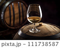 Wine Glass with Chardonnay Grapevine tasting. Vino Degustation in wine cellar with Wine barrels. 111738587
