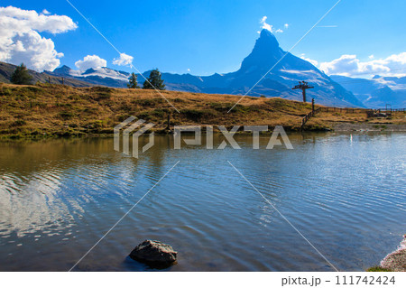 View of Leisee lake and Matterhorn mountain at summer on the Five Lakes Trail in Zermatt, Switzerland View of Leisee lake and Matterhorn mountain at summer on the Five Lakes Trail in Zermatt, Switzerland 111742424
