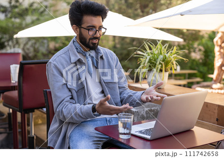 Young bearded hindu man having a video call Young bearded hindu man having a video call 111742658
