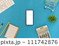 Top view of smartphone with blank screen and calculator with alarm clock on blue color background. 111742876