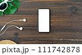 Top view of smartphone with blank screen on wood background, Template for placing your ad. 111742878