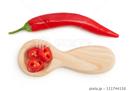 red hot chili pepper slices in wooden spoon isolated on white background. Top view. Flat lay. 111744138